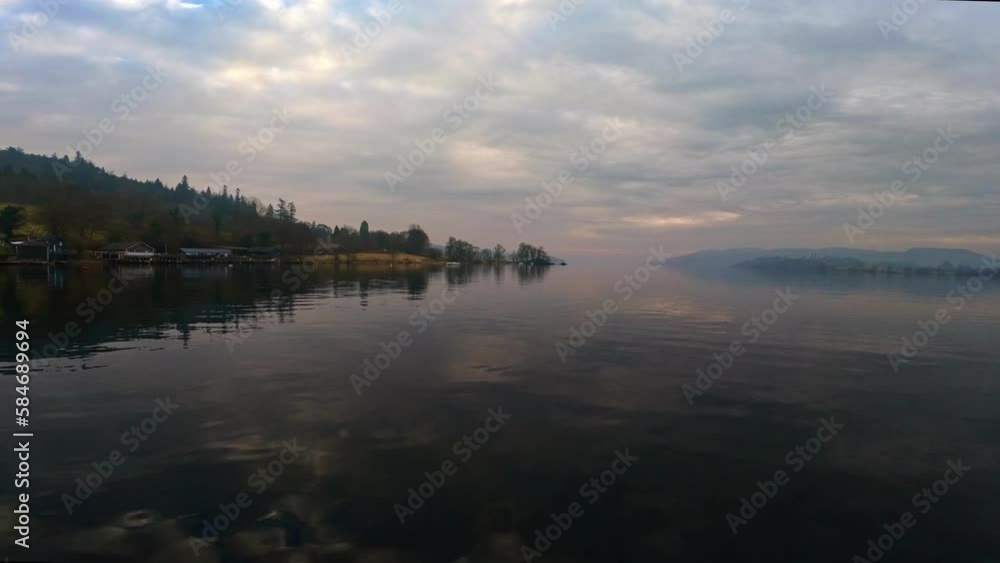 Misty scene over Lake Windermere in the English Lake District National Park. UK Misty scene over Lake Windermere in the English Lake District National Park. UK