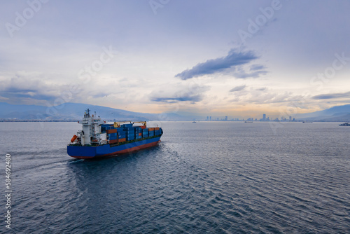 Cargo container ship vessel cruising to port, concept fast freight shipping ship. import export of global goods
