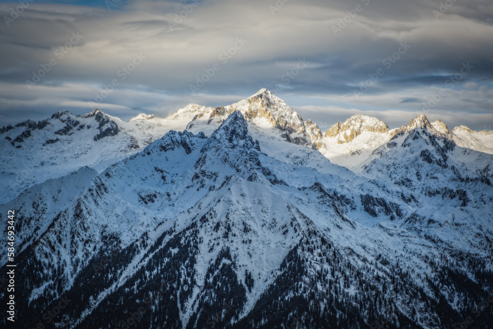 The Dolomites mountains in beautiful winter day. Pinzolo ski resort, Italy. January 2023