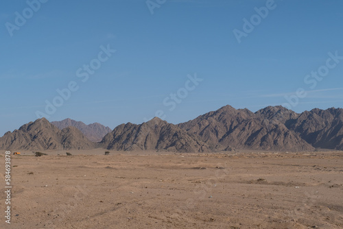 Sinai mountains at daytime, blue sky, top view of the mountains, colorful canyon at sunset in Egypt sunny day, landscape