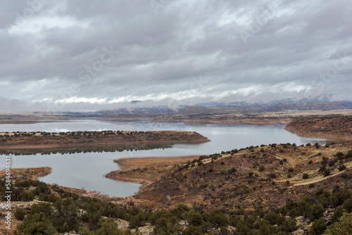 Winding water basin with cloudy sky in the high desert