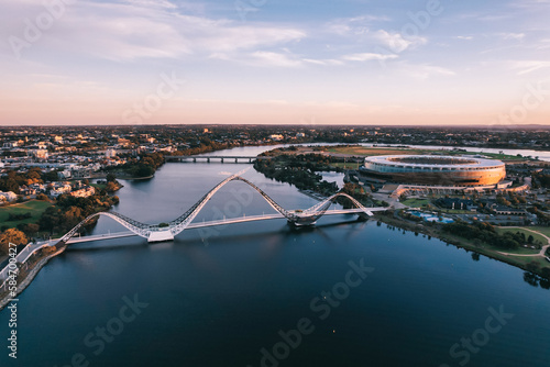 Panoramic aerial view at sunrise of Matagarup Bridge across the Swan River in the city of Perth, Western Australia