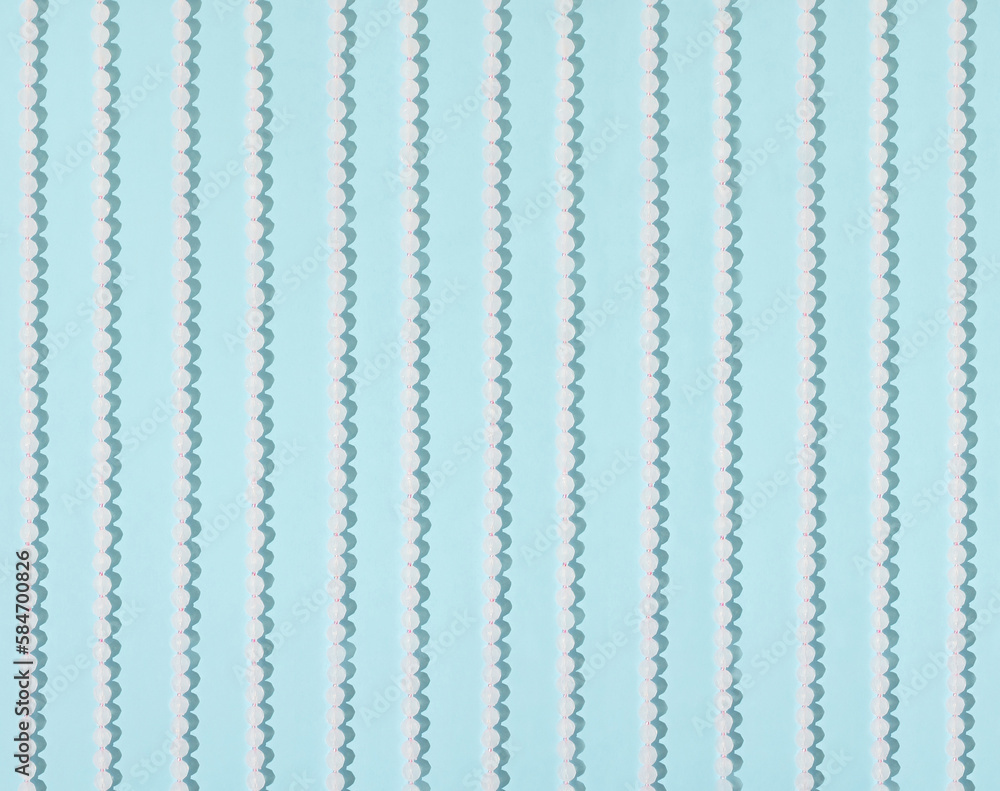 Pattern of pink perls neckless on light blue background. Flat lay concept. Pattern of pink perls neckless on light blue background. Flat lay concept.