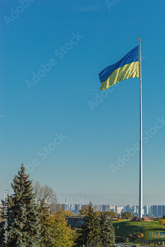 Ukrainian flag against the blue sky