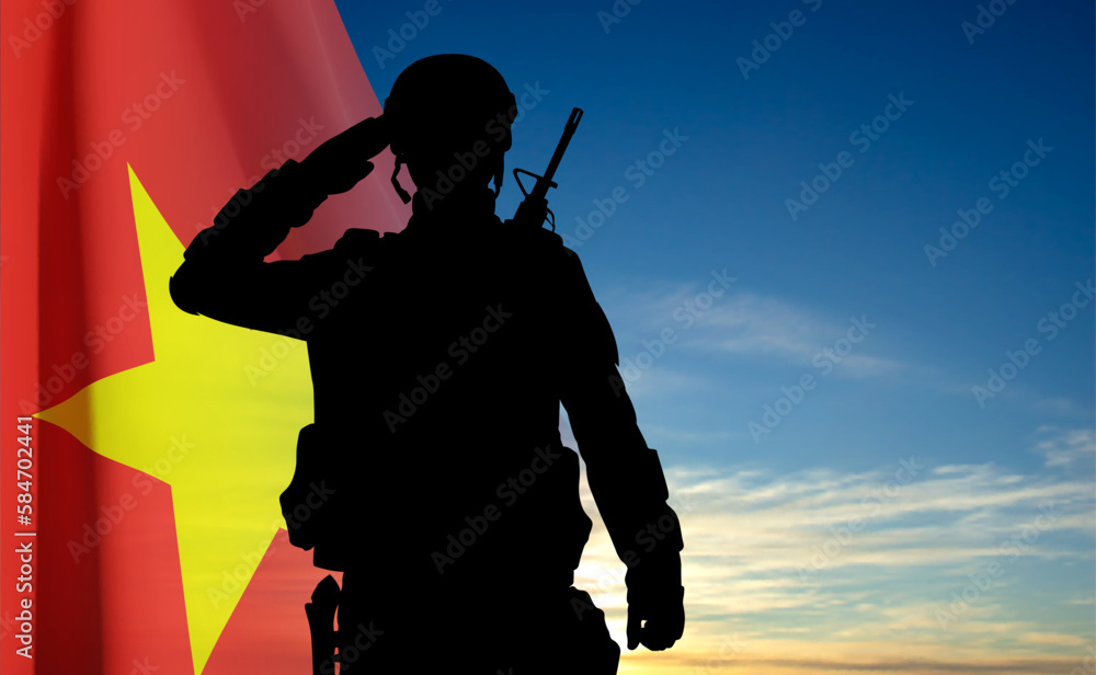 Silhouette of a saluting soldier against the Vietnam flag and blue sky. EPS10 vector Silhouette of a saluting soldier against the Vietnam flag and blue sky. EPS10 vector