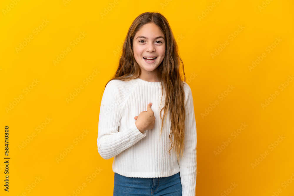 Child over isolated yellow background with surprise facial expression Child over isolated yellow background with surprise facial expression