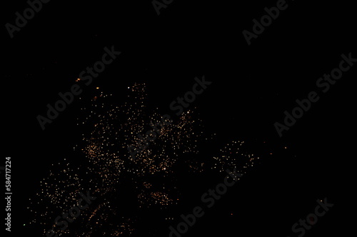 Fireworks in the night sky. New Year's celebration sparkler at night.burning sparkler for Christmas.Shiny natural fireworks on dark sky background. Firework Celebration Anniversary