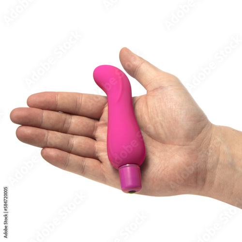 vibrador pequeno de clitoris na mão da cor rosa  photo
