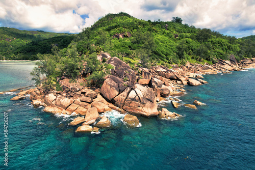 Baie Lazare huge rocks and the sea side, lush vegetation, Mahe Seychelles