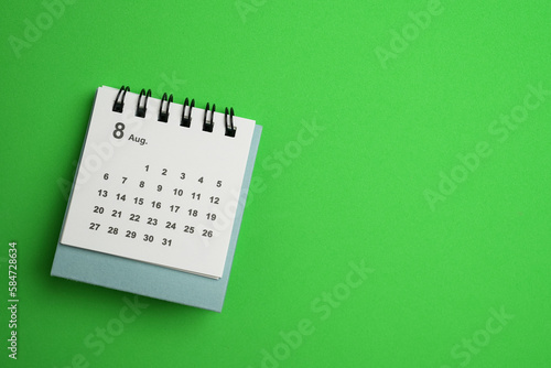 close up of calendar on the green table background, planning for business meeting or travel planning concept