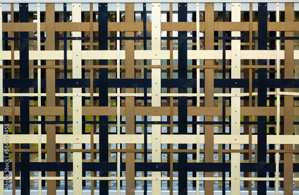 Closeup of a colorful abstract metal fence pattern Closeup of a colorful abstract metal fence pattern