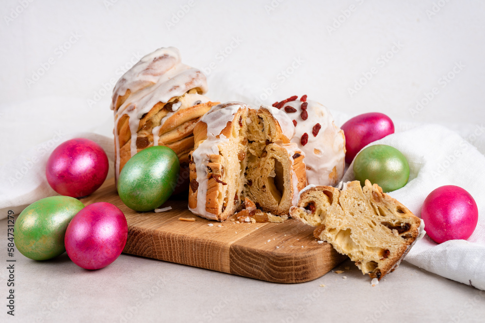 Easter cruffin cakes and colored Easter eggs beautifully arranged on board Easter cruffin cakes and colored Easter eggs beautifully arranged on board