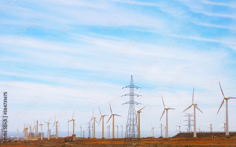 Wind farm with wind turbines and high voltage wires
