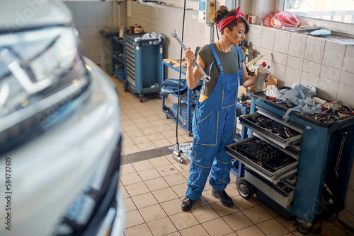 Woman mechanic working. mechanic female having fun at work