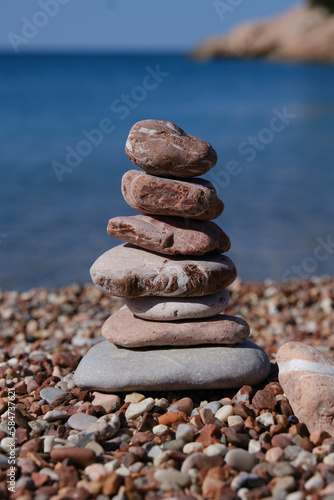 Balance stones close-up on the beach at summer sunny day