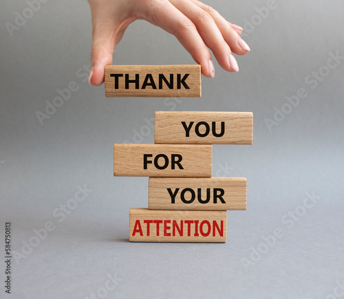 Attention symbol. Wooden blocks with words Thank you for your attention. Beautiful grey background. Businessman hand. Business and Thank you for your attention concept. Copy space.