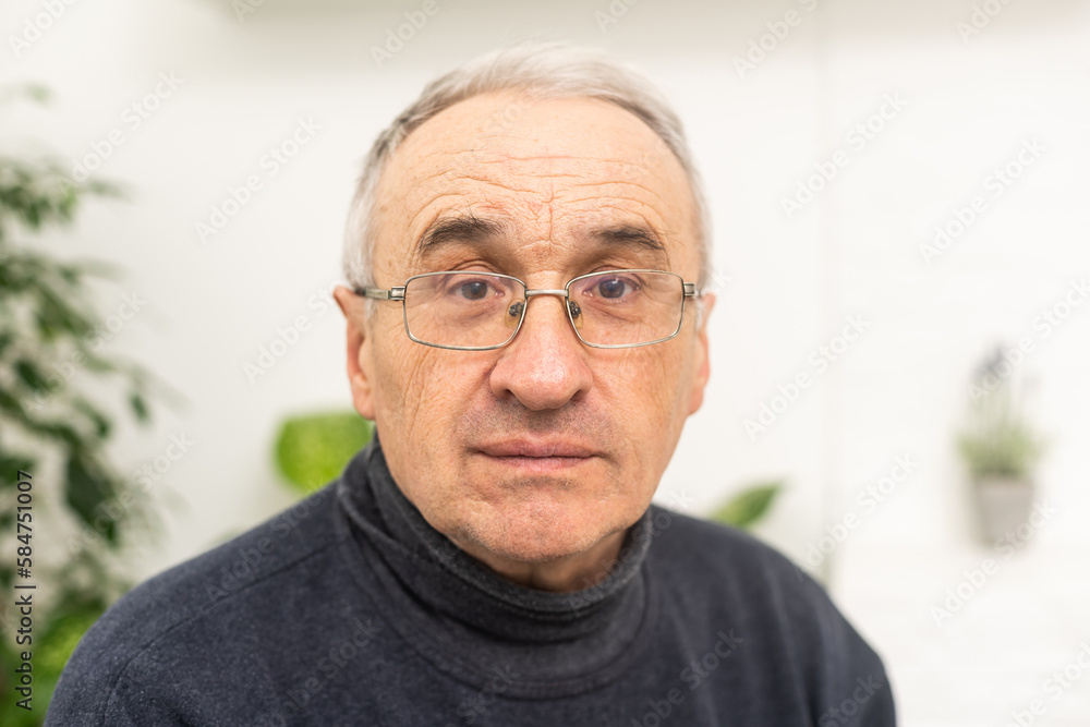 Portrait elderly man on gray background Portrait elderly man on gray background