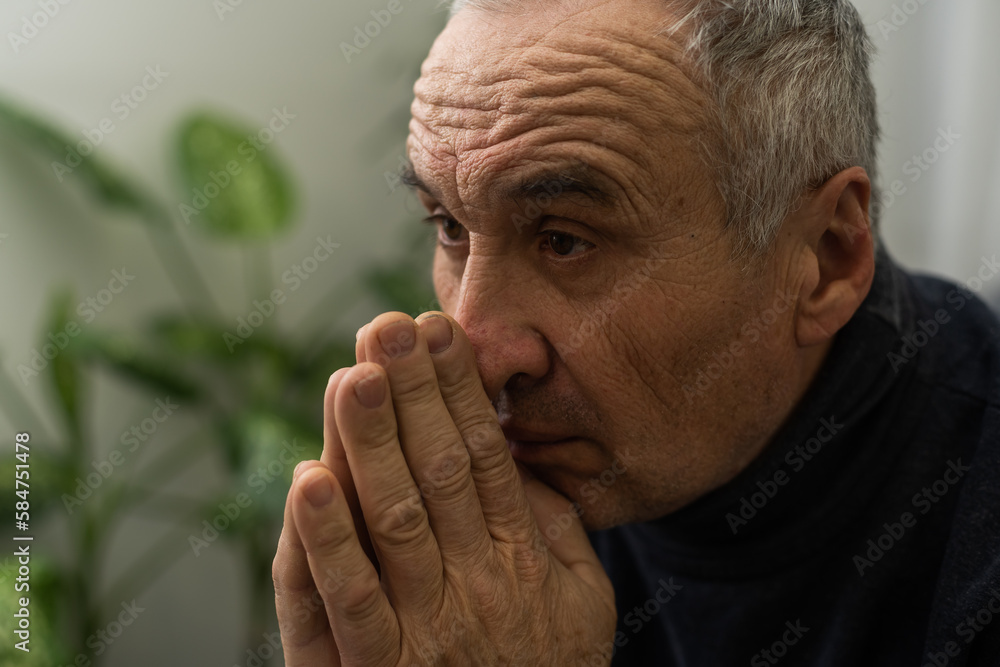 Please, Lord. Nervous worried aged Caucasian man praying on couch at home. Stressed white European senior citizen sitting on sofa, begging for forgiveness or asking God for help in difficult situation Please, Lord. Nervous worried aged Caucasian man praying on couch at home. Stressed white European senior citizen sitting on sofa, begging for forgiveness or asking God for help in difficult situation