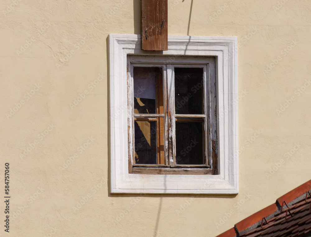 Close-up view of an old wooden window on a yellow facade, Upper Town, Zagreb, Croatia	