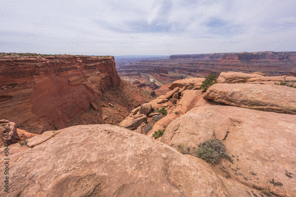 hiking the dead horse trail in dead horse point state park in utah, usa hiking the dead horse trail in dead horse point state park in utah, usa