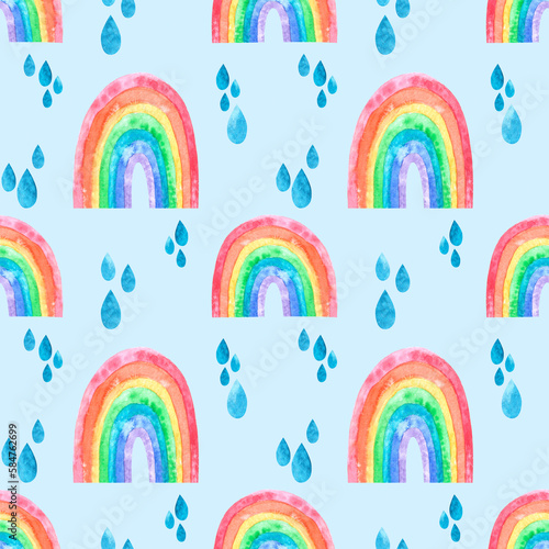 Hand drawn seamless pattern with funny cute rainbows with multicolored spectrum gradient and rain drops on blue. Illustrated background for print fabric, cards and design