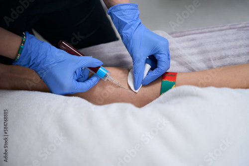 Doctor taking blood for blood test in hospital