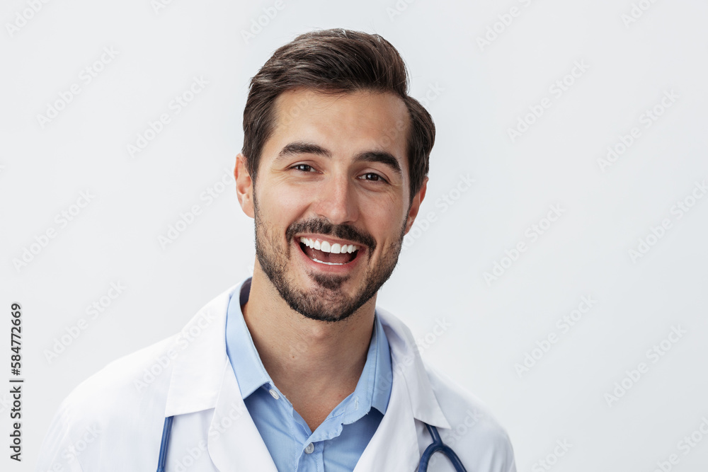 Man doctor in white coat with stethoscope and eyeglasses on white isolated background looking into camera, copy space, space for text, health Man doctor in white coat with stethoscope and eyeglasses on white isolated background looking into camera, copy space, space for text, health