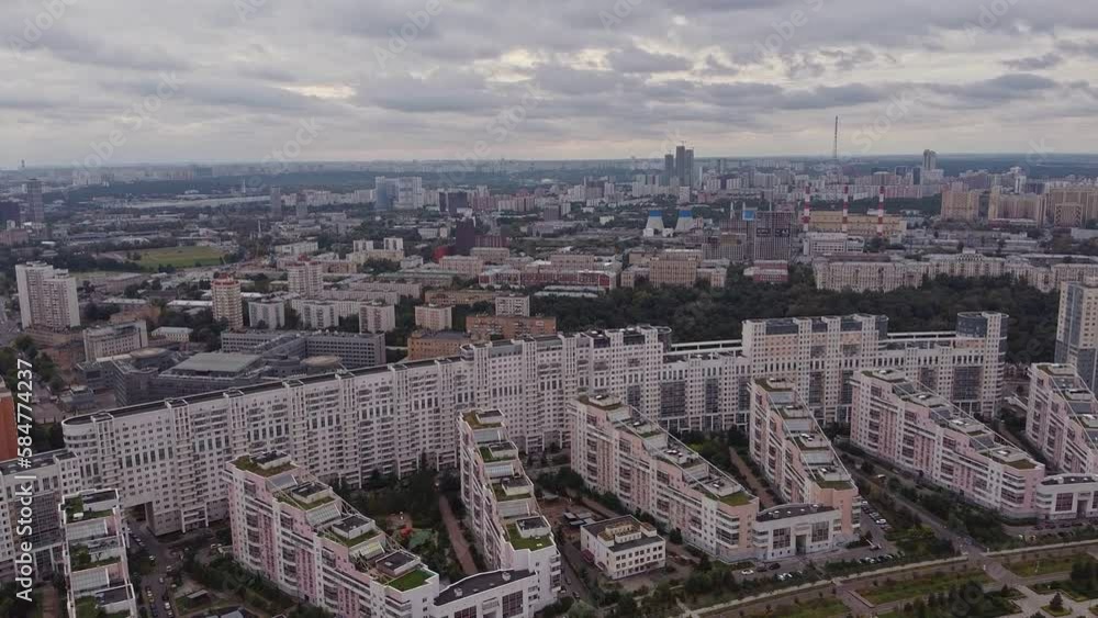 Establishing shot on a modern district of Moscow in the summer. Air view of the quarter with developed infrastructure and modern houses Establishing shot on a modern district of Moscow in the summer. Air view of the quarter with developed infrastructure and modern houses