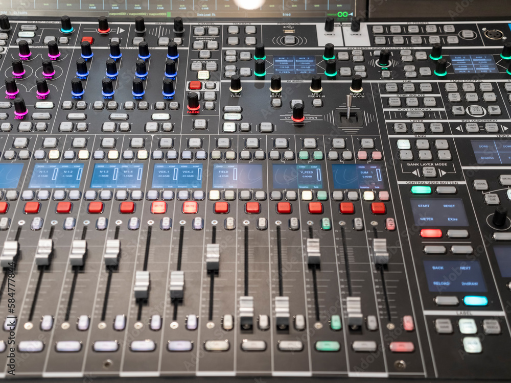 Sound audio mixer of sliders and buttons on a console with connected audio jacks Sound audio mixer of sliders and buttons on a console with connected audio jacks