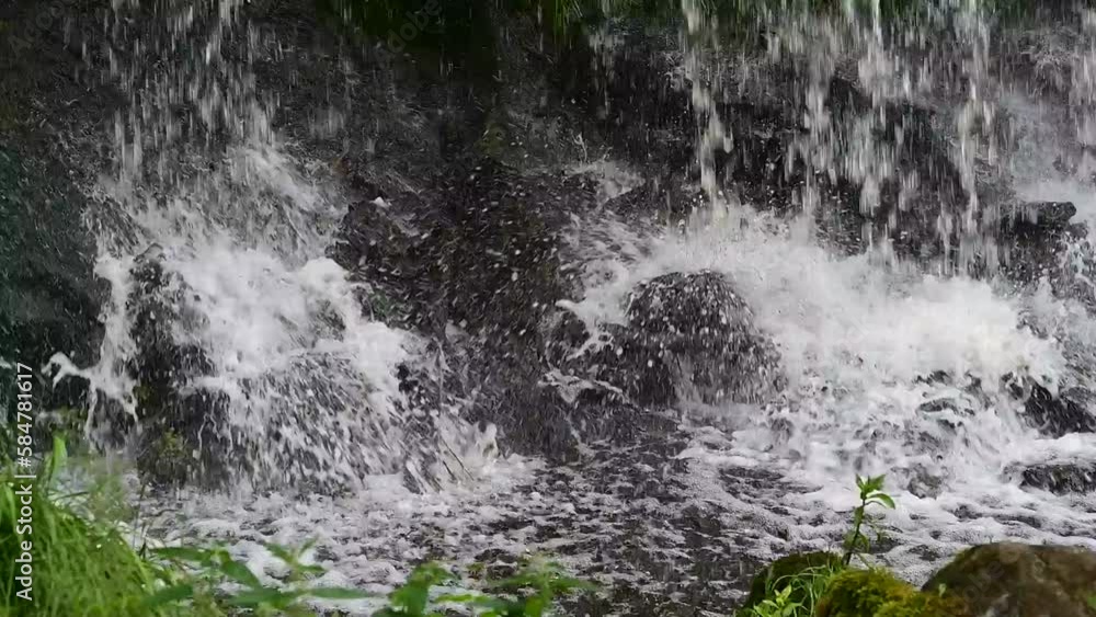 A waterfall on a beautiful midsummer day on the Keila River in Estonia.
