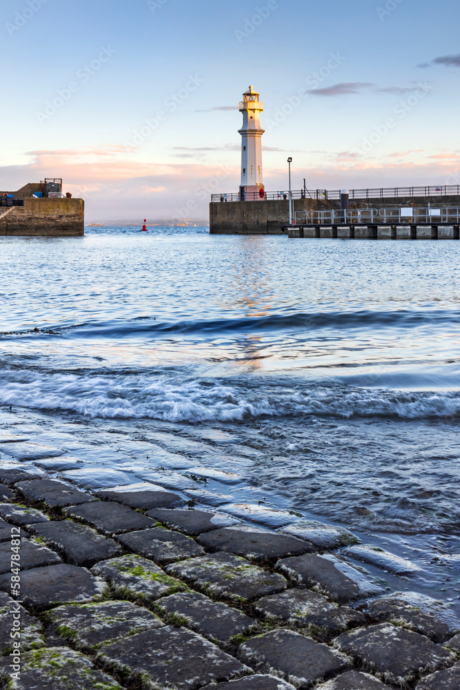 Newhaven Harbour on the Firth of Forth. Newhaven is a district in the City of Edinburgh, Scotland, between Leith and Granton and about 2 miles north of the city centre. Taken just after sunrise.