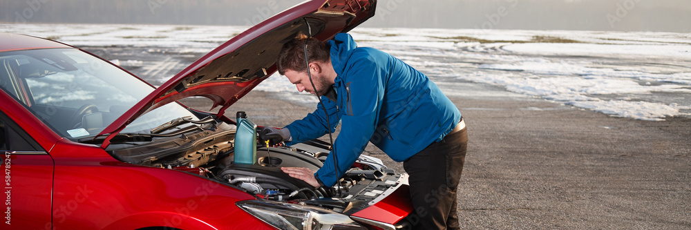 Checking the oil level in a modern car Checking the oil level in a modern car