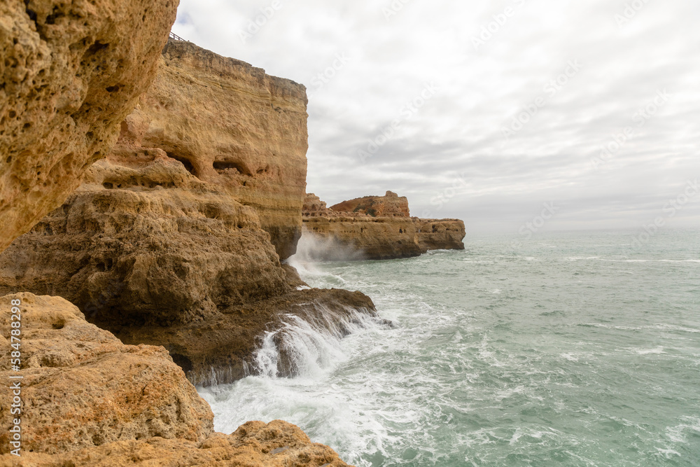 The spectacular rocky Atlantic coastline of southern Portugal is seen from near Carvoeiro. 