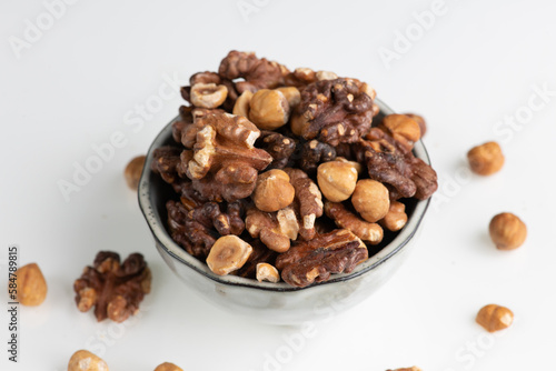 pile of mixed nuts in a ceramic bowl