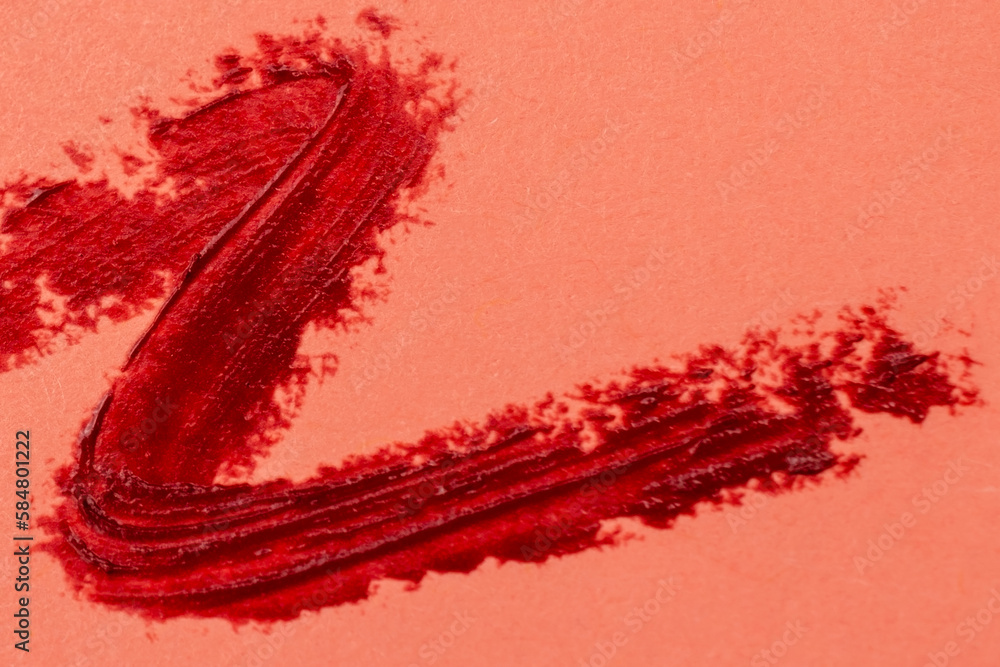 Brush strokes of paint on pink background, lipstick marks on paper Brush strokes of paint on pink background, lipstick marks on paper
