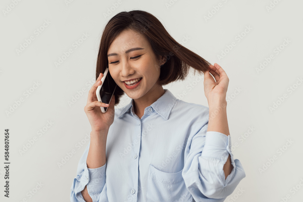 woman smiling and using her smart phone woman smiling and using her smart phone
