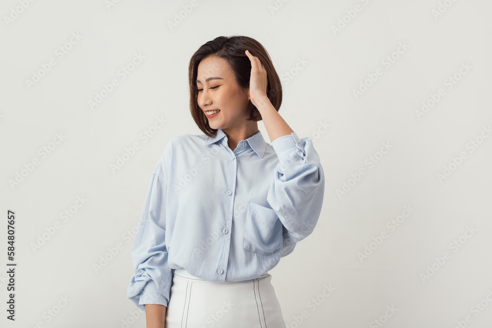 Happy asian woman looking at the camera over white background Happy asian woman looking at the camera over white background