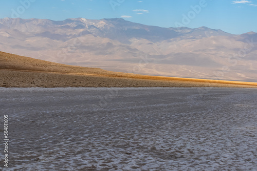 Scenic view of Badwater Basin salt flats in Death Valley National Park, California, USA. Endorheic basin is the lowest, driest, and hottest area in North America. Majestic Panamint Mountains in back