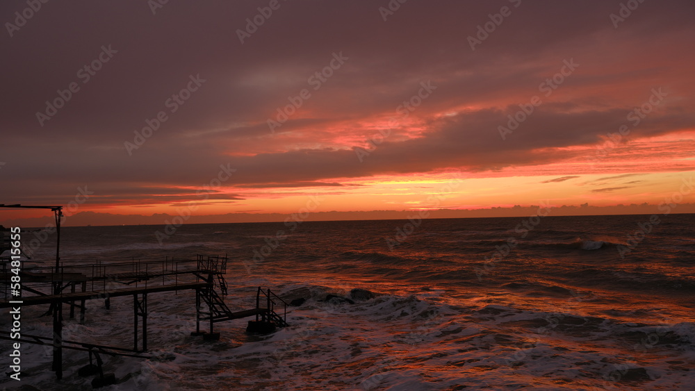 Close Up sea.
Orange sky.Amazing red sunrise on beach. Close Up sea.
Orange sky.Amazing red sunrise on beach.