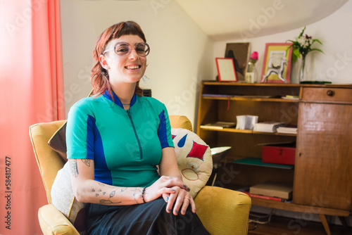 Non binary artist with mullet smiling portrait photo