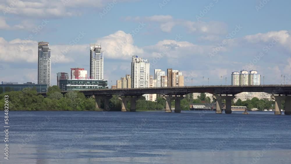 2022 - establishing shot of the Mist Patona bridge over the Dnipro River in Kyiv, Kiev, Ukraine. 2022 - establishing shot of the Mist Patona bridge over the Dnipro River in Kyiv, Kiev, Ukraine.