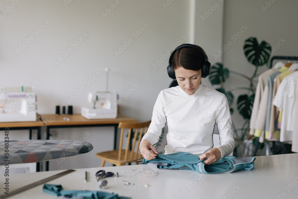 Hoodie. Garment manufacture. Seamstress at work. Relax Hoodie. Garment manufacture. Seamstress at work. Relax