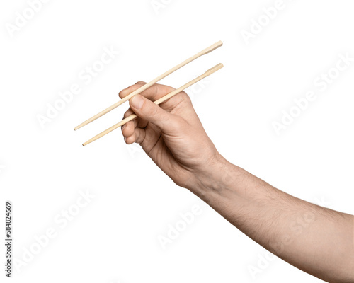 Bamboo chopsticks for sushi in a male hand