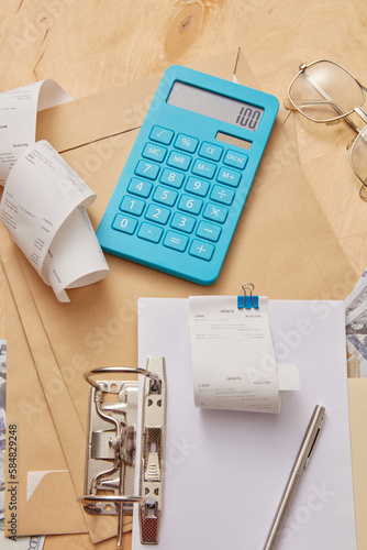 Close up of calculator, documents and envelopes. photo