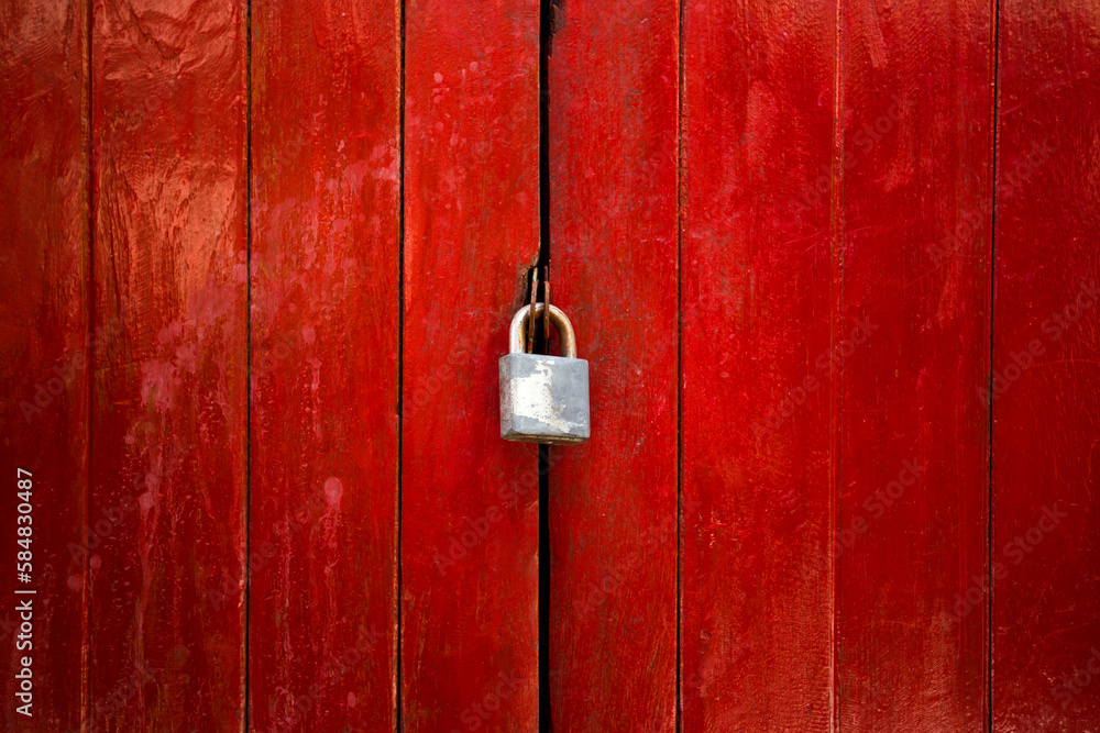 locked vintage red door and key