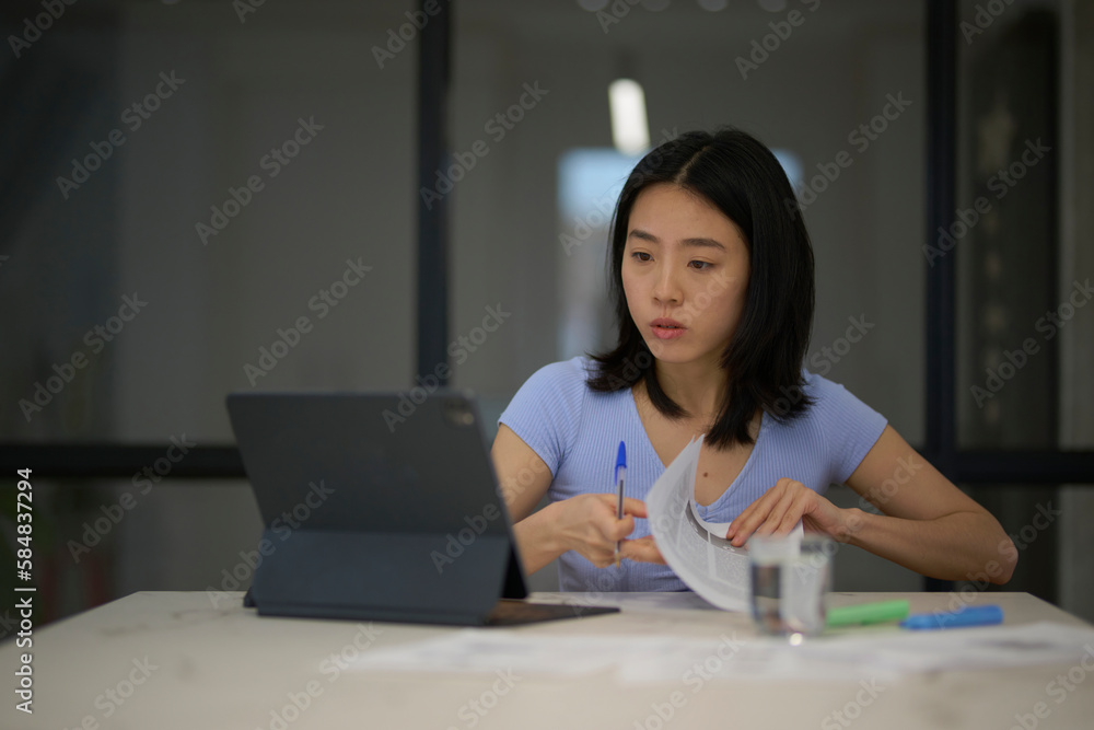 Focused employee working with tablet. Focused employee working with tablet.