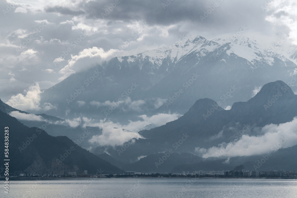 Antalya Bay and Taurus Mountains in cloudy weather after rain