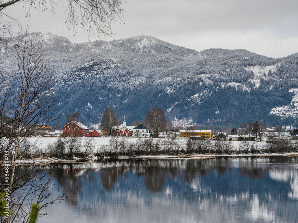 Beautiful Norwegian village Fla on Hallingdalselva river during winter in Norway