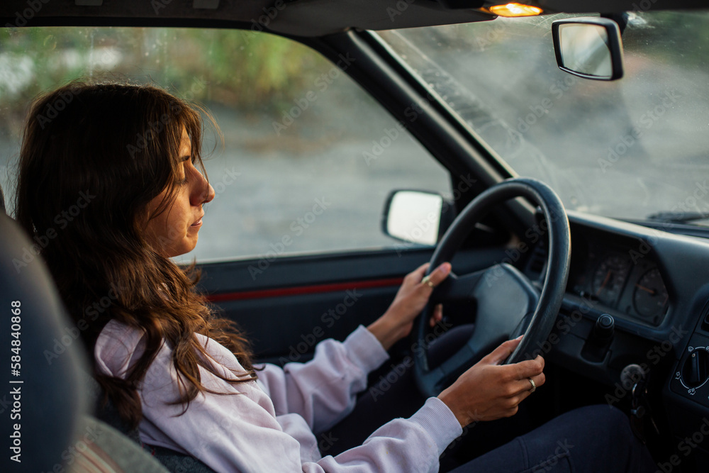Young female driving a car Young female driving a car