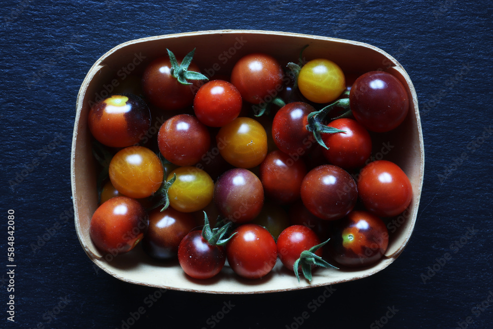 Photography of cherry tomatoes in a wooden crate for food illustrations Photography of cherry tomatoes in a wooden crate for food illustrations
